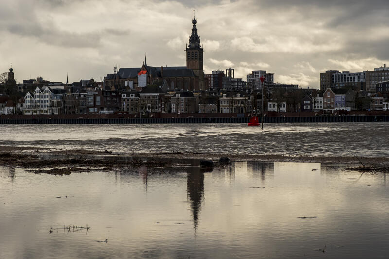 High Water on the Waal River Reflected in Nijmegen Skyline